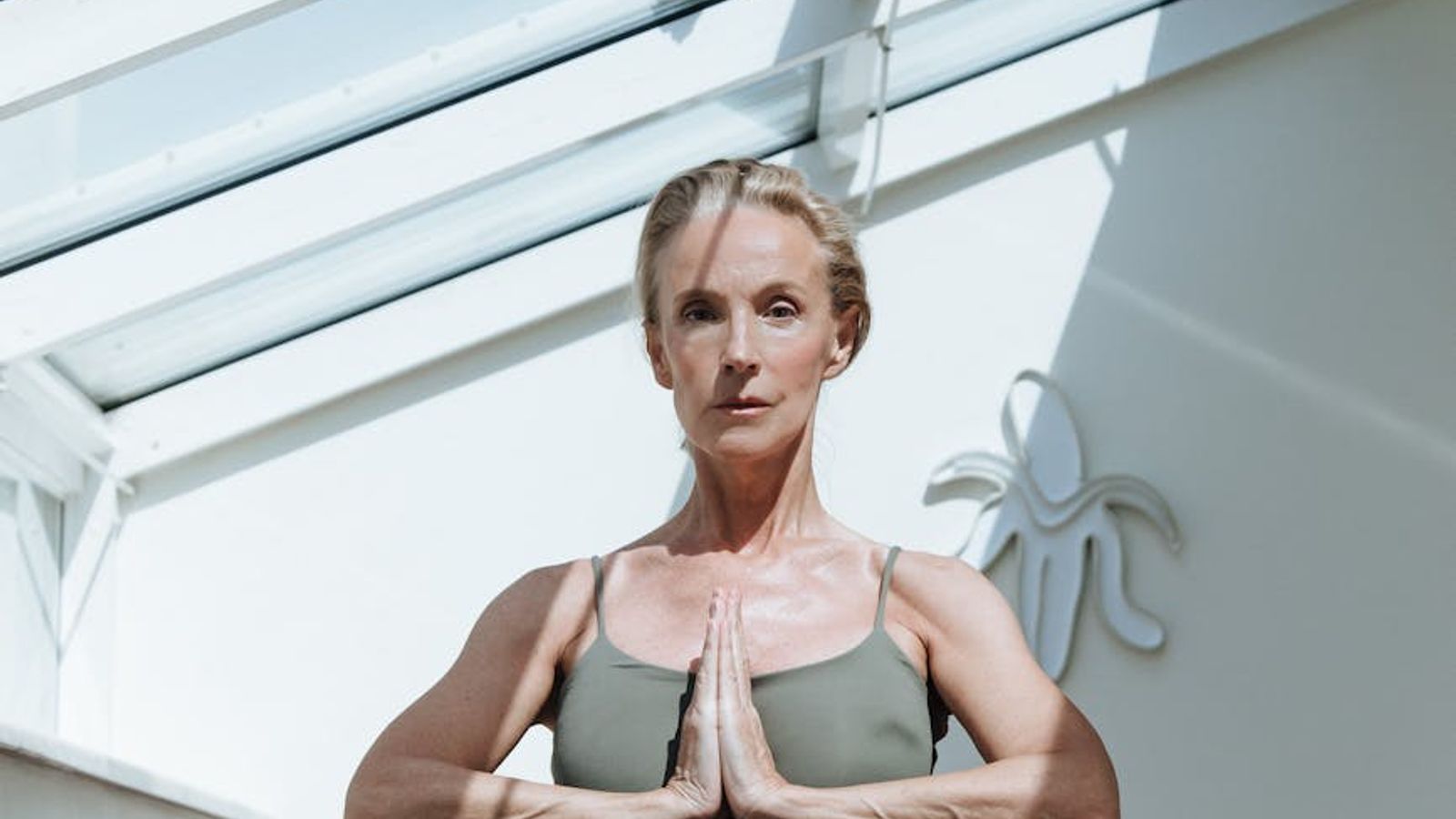 Minimalist, calm space for yoga practice with soft natural light.